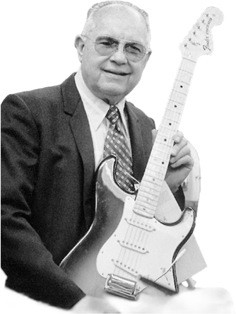 Leo Fender with a Stratocaster guitar