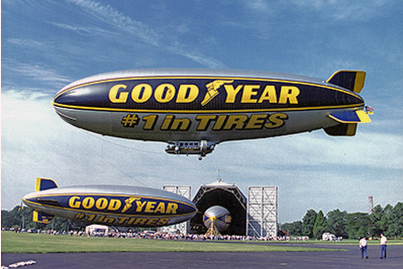 3 blimps at goodyear'100 aniversary as company